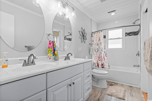 full bathroom featuring hardwood / wood-style flooring, shower / tub combo, vanity, ornamental molding, and toilet