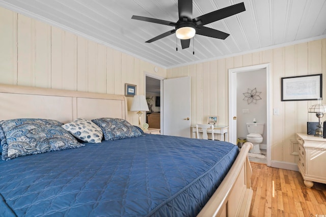 bedroom with ceiling fan, ornamental molding, ensuite bath, and light hardwood / wood-style flooring