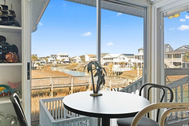 sunroom with a water view