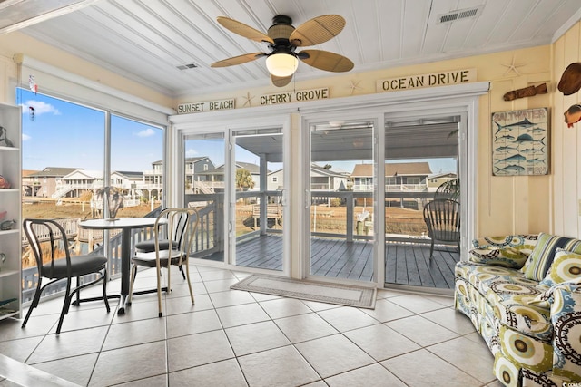 sunroom / solarium with ceiling fan