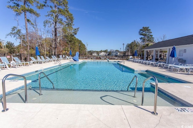 view of swimming pool with a patio