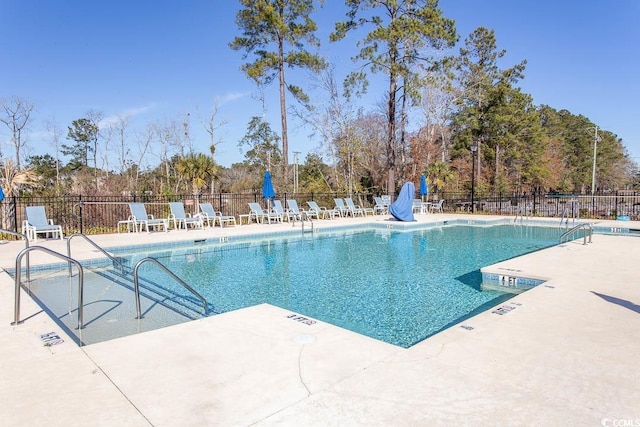 view of swimming pool with a patio area