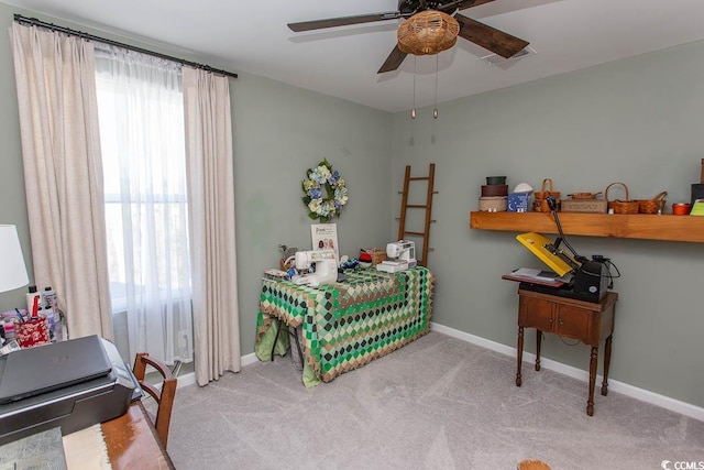 bedroom with ceiling fan and light colored carpet