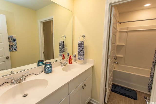 bathroom with shower / tub combination and vanity