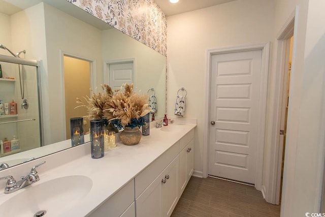 bathroom with vanity and an enclosed shower