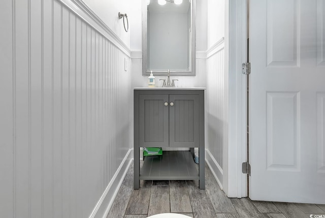 bathroom featuring hardwood / wood-style flooring and vanity