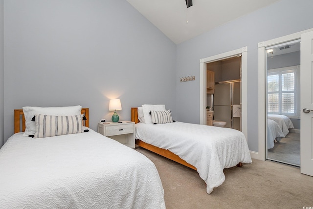 bedroom featuring lofted ceiling and light colored carpet