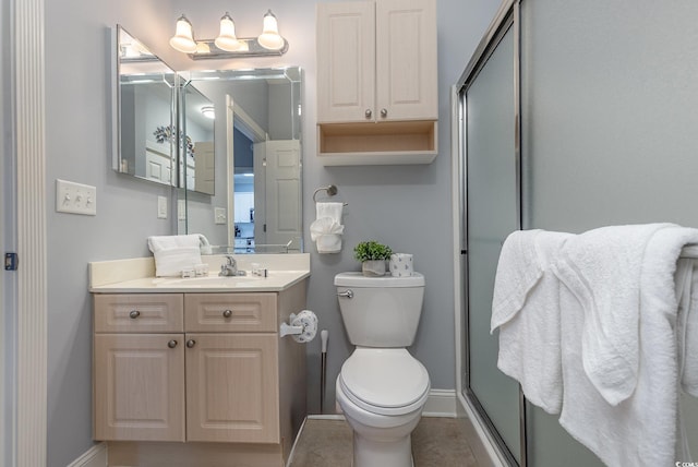 bathroom featuring walk in shower, vanity, and toilet