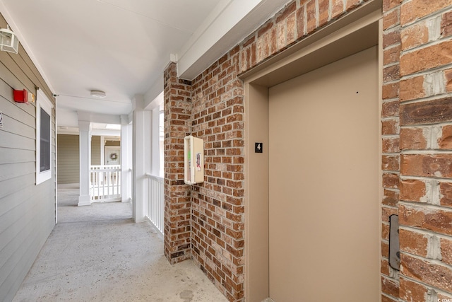 entrance to property featuring elevator