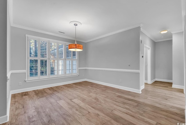 unfurnished dining area featuring crown molding and light hardwood / wood-style flooring