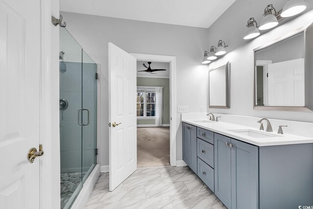 bathroom with ceiling fan, vanity, and a shower with door