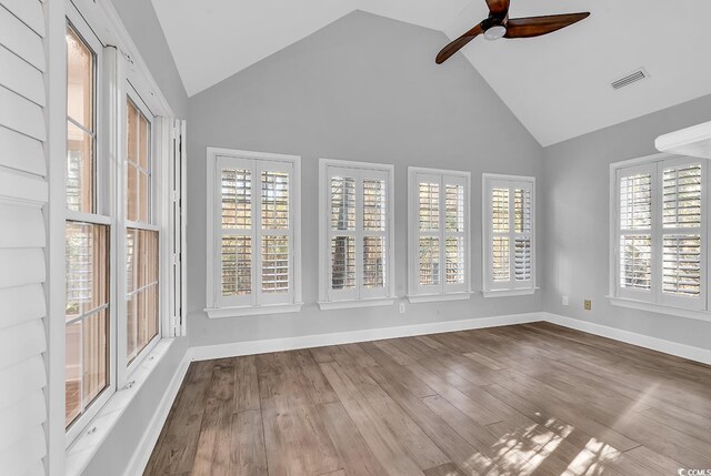 interior space with ceiling fan and vaulted ceiling