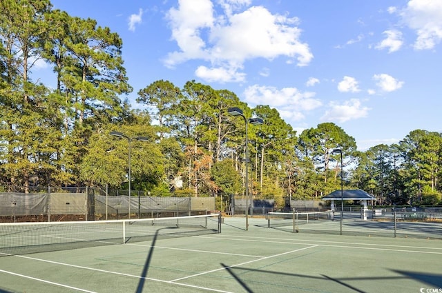 view of sport court with fence