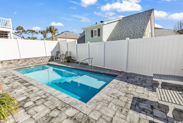 view of swimming pool featuring a patio area