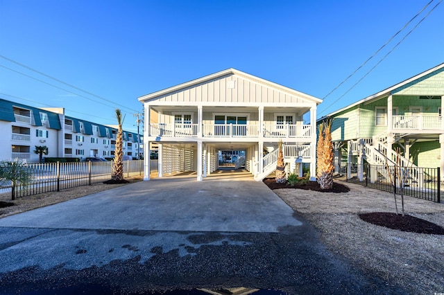 view of front of home with a carport and covered porch