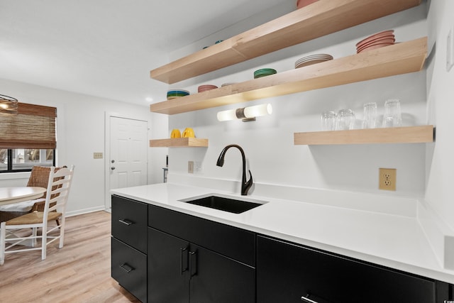 kitchen featuring sink and light wood-type flooring