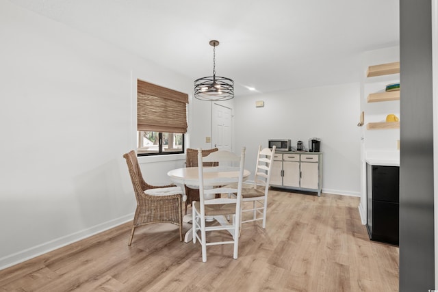 dining space with light wood-type flooring