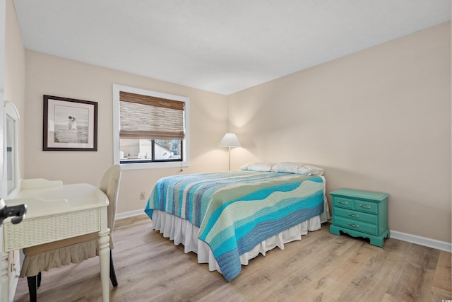 bedroom with light hardwood / wood-style floors