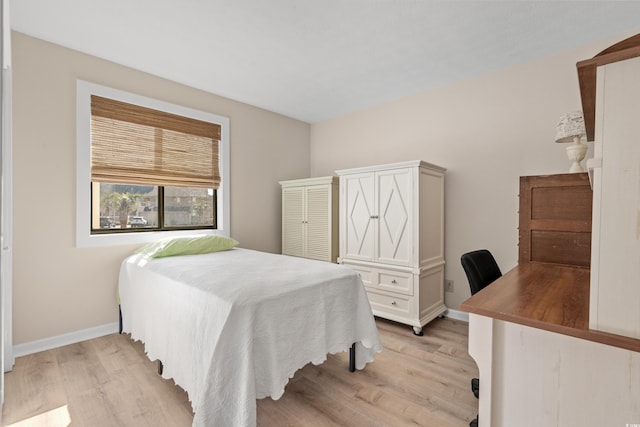 bedroom with light hardwood / wood-style flooring