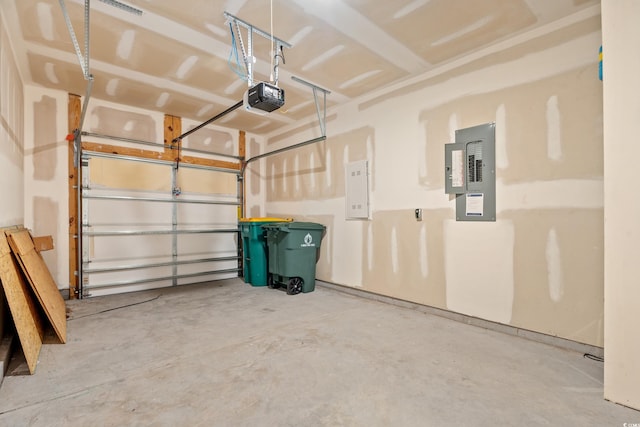 garage featuring a garage door opener and electric panel