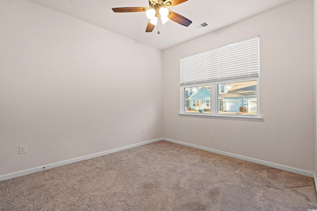 carpeted empty room featuring ceiling fan