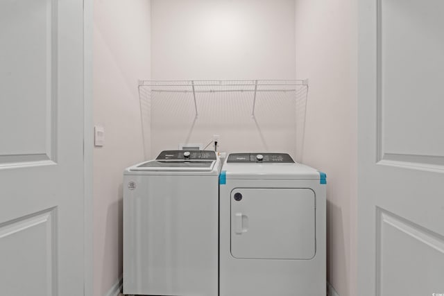 laundry room featuring separate washer and dryer