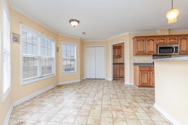 kitchen with decorative light fixtures and ornamental molding