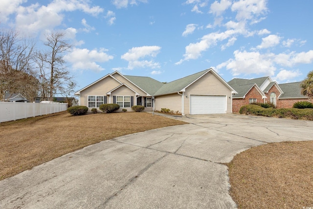 ranch-style home with a garage and a front yard