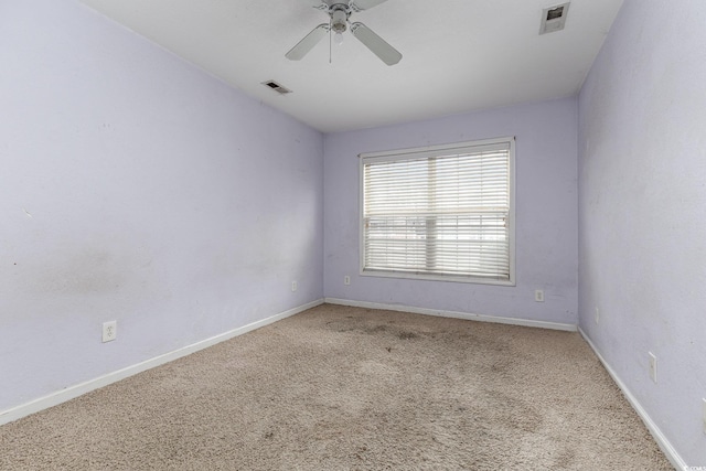 empty room with light colored carpet and ceiling fan