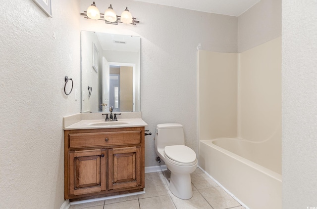 full bathroom with shower / tub combination, vanity, tile patterned floors, and toilet