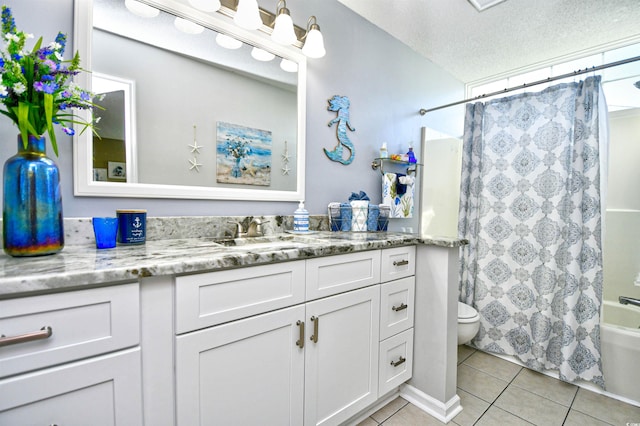 2225 Essex Dr Unit F, Surfside Beach, SC 29575 - bathroom with a textured ceiling, toilet, shower / tub combo with curtain, tile patterned flooring, and vanity