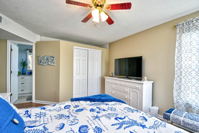 2225 Essex Dr Unit F, Surfside Beach, SC 29575 - bedroom featuring a closet, wood finished floors, a textured ceiling, ceiling fan, and baseboards