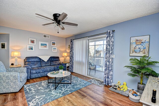 2225 Essex Dr Unit F, Surfside Beach, SC 29575 - living area featuring a ceiling fan, visible vents, a textured ceiling, and wood finished floors