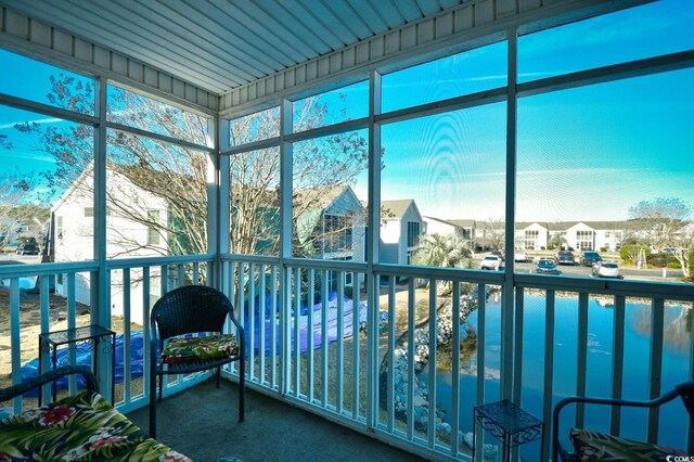 2225 Essex Dr Unit F, Surfside Beach, SC 29575 - sunroom / solarium featuring a healthy amount of sunlight and a residential view