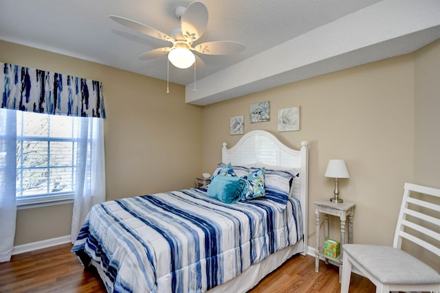 2225 Essex Dr Unit F, Surfside Beach, SC 29575 - bedroom with baseboards, a ceiling fan, and wood finished floors