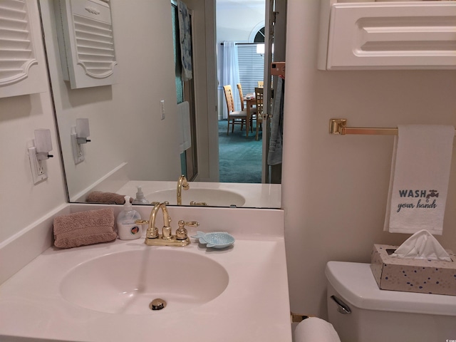 bathroom with toilet and sink