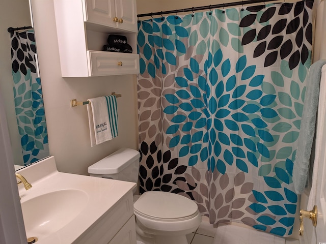 bathroom with walk in shower, vanity, toilet, and tile patterned flooring