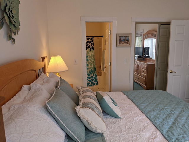 bedroom featuring a walk in closet and a closet