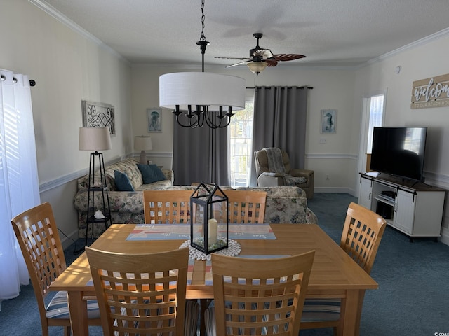 carpeted dining area featuring ornamental molding, a healthy amount of sunlight, ceiling fan, and a textured ceiling