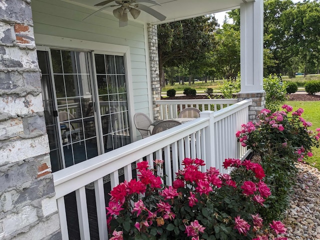 balcony with ceiling fan and covered porch