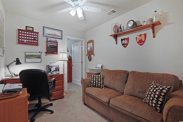 carpeted office with ceiling fan