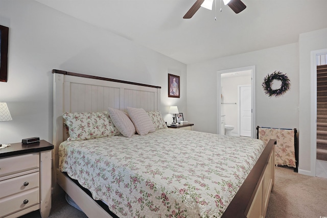 carpeted bedroom featuring ensuite bathroom and ceiling fan