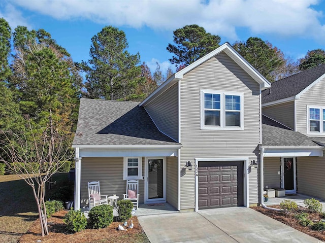 view of front of home with a garage and a porch