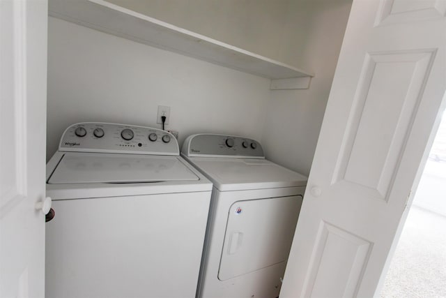 laundry area with washing machine and dryer