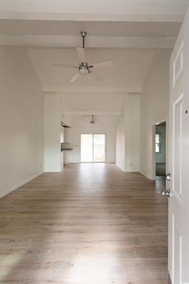 unfurnished room with beamed ceiling, ceiling fan, high vaulted ceiling, and hardwood / wood-style floors