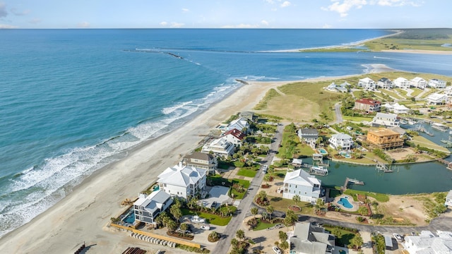 bird's eye view with a water view and a view of the beach