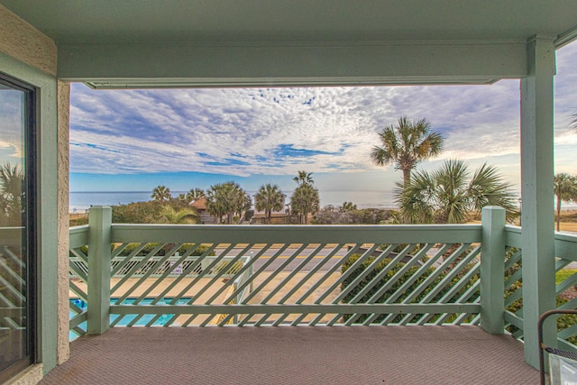 balcony featuring a water view