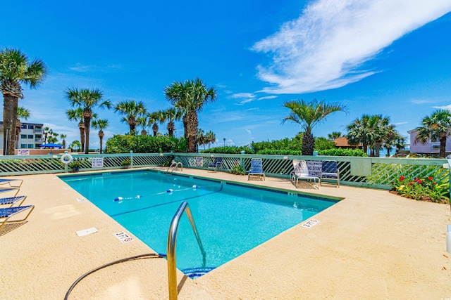 view of swimming pool with a patio