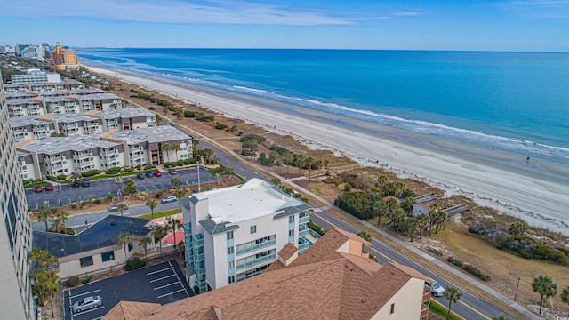 drone / aerial view featuring a view of the beach and a water view