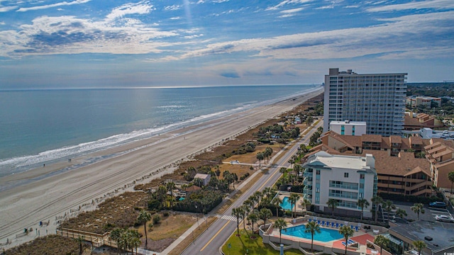 aerial view with a water view and a view of the beach